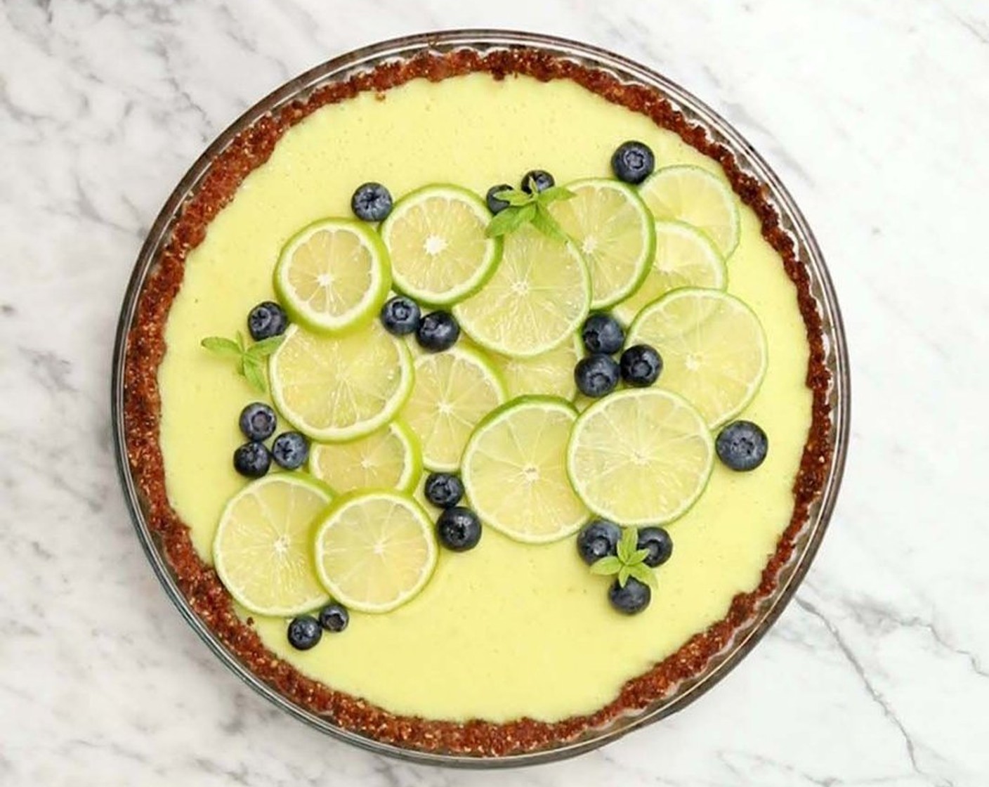 Schritt 7 Den Key Lime Pie vor dem Servieren mit Limettenscheiben (1), Beeren oder anderen Früchten garnieren.