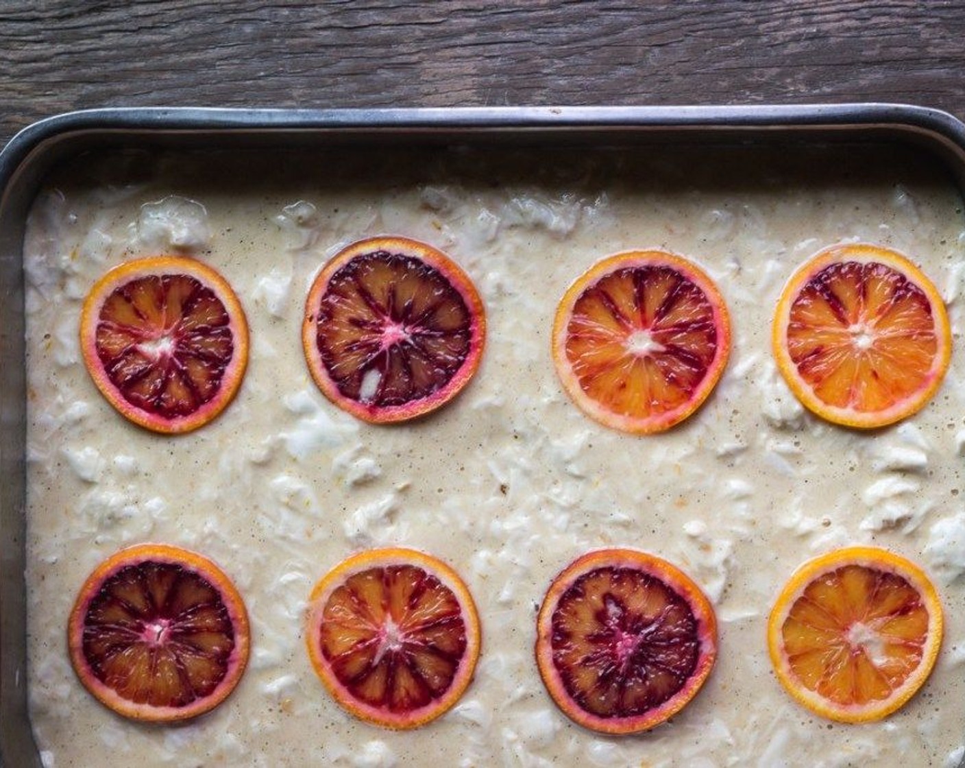 Schritt 11 Den Kuchen mit Orangenscheiben garnieren.